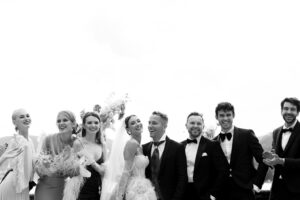 A black & white group picture of friends right after the wedding ceremony at Lake Como in Italy